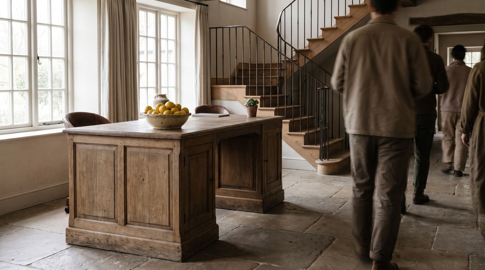 The stone-floored reception hall with an oak desk